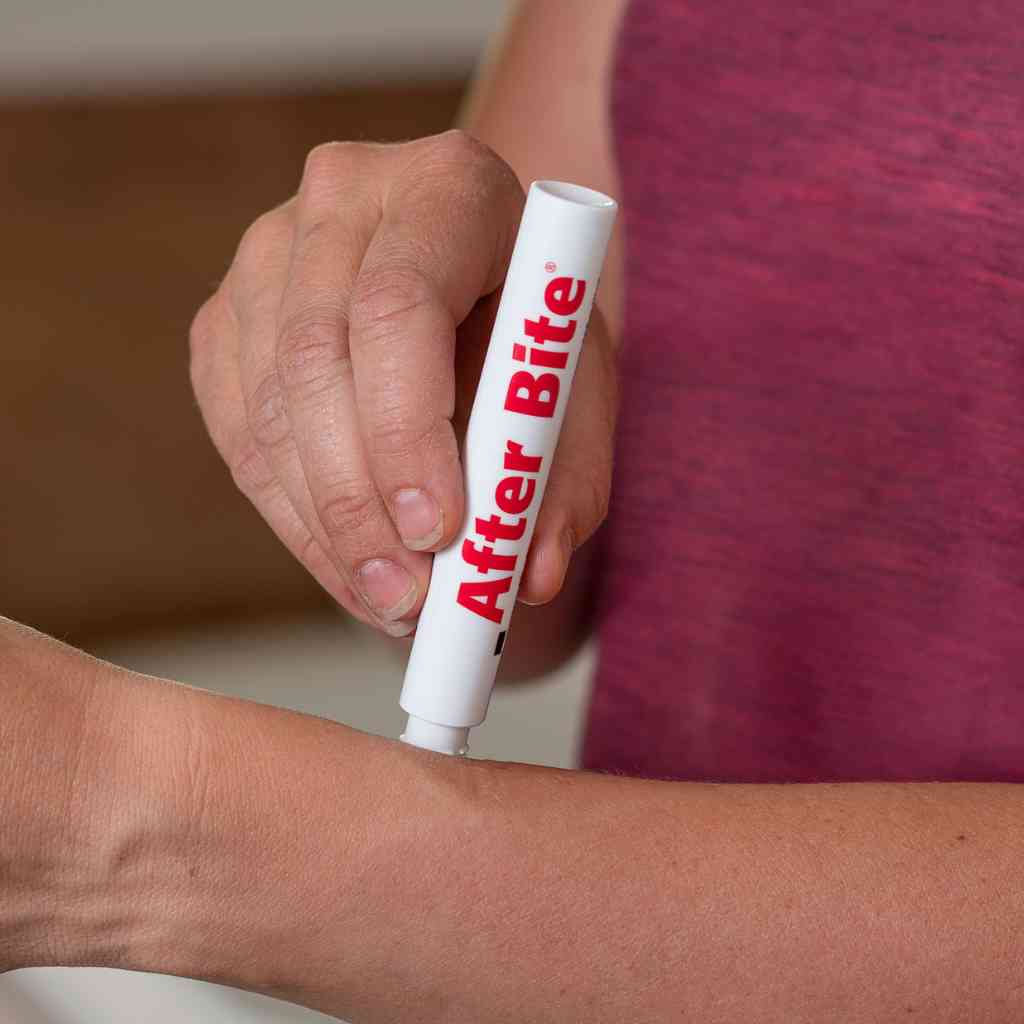 After Bite Advanced woman in pink shirt applying to arm