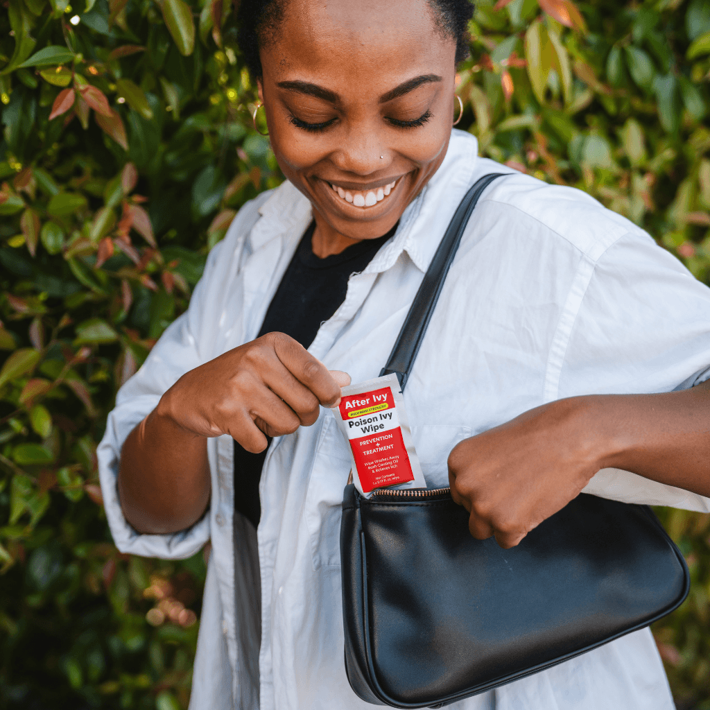 Woman storing an After Ivy packet in her purse
