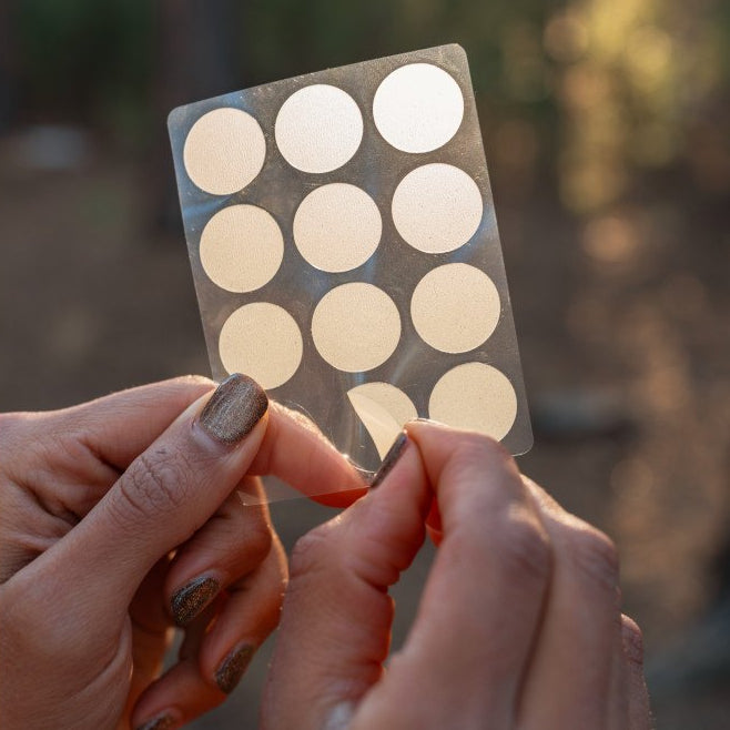 pulling bandage off of sheet 